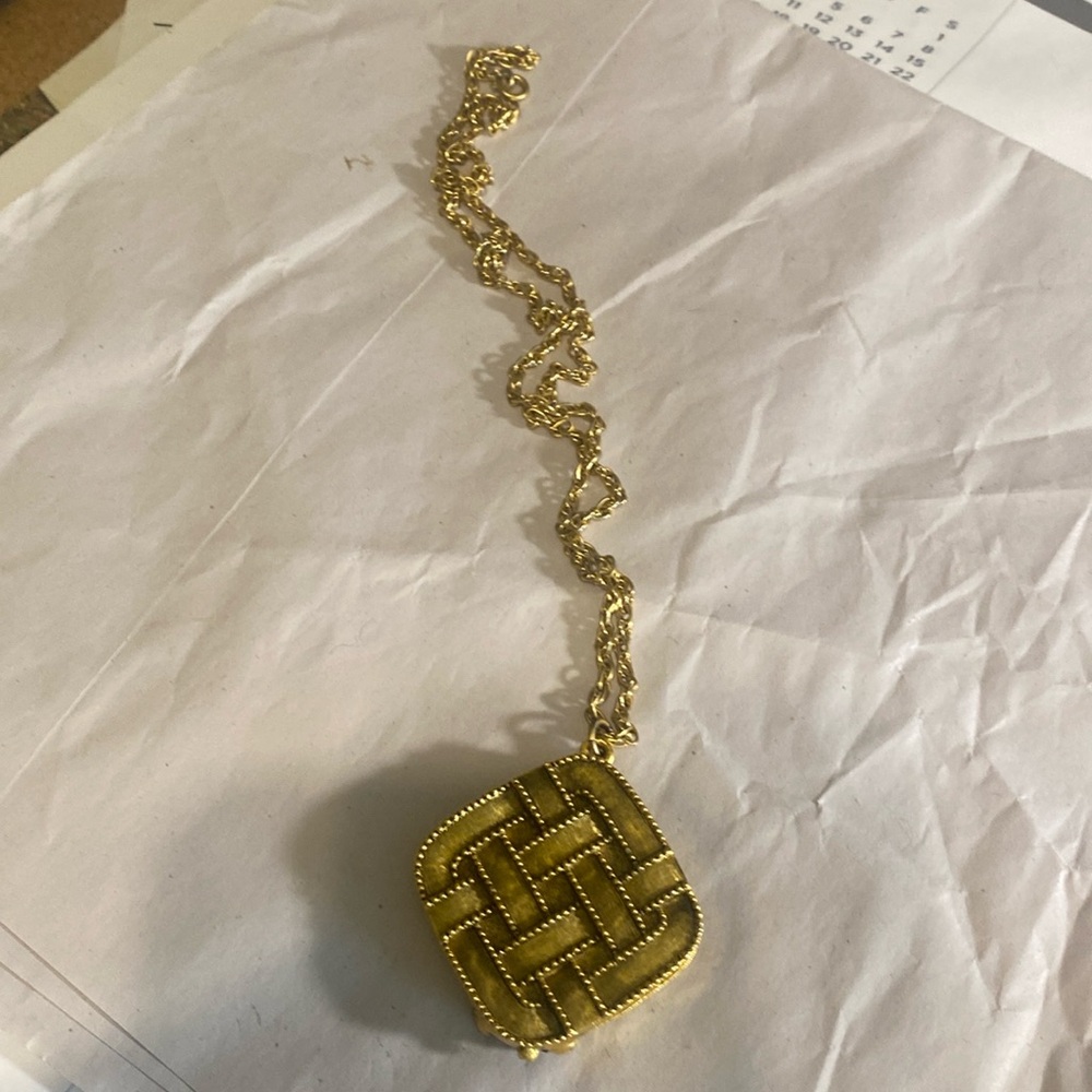 Prince Matchabelli perfume locket in a basket weave pattern.